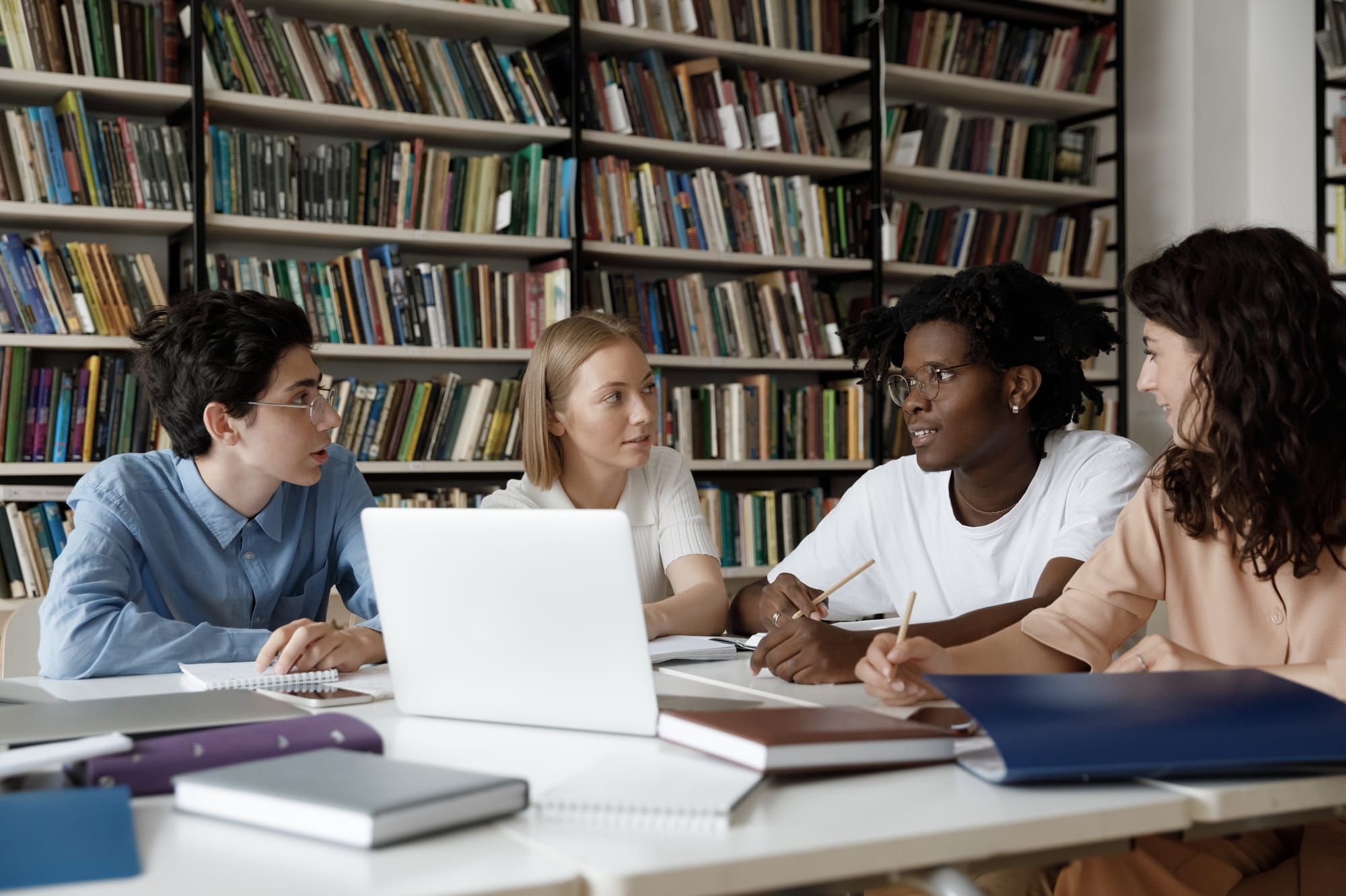 Young people working together in a library